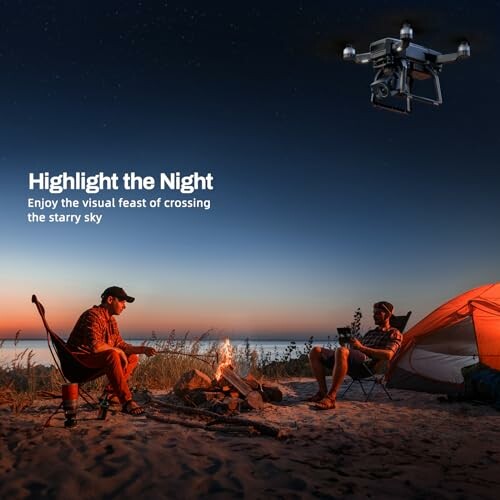 Two people sitting by a campfire on a beach at dusk with a drone flying overhead.